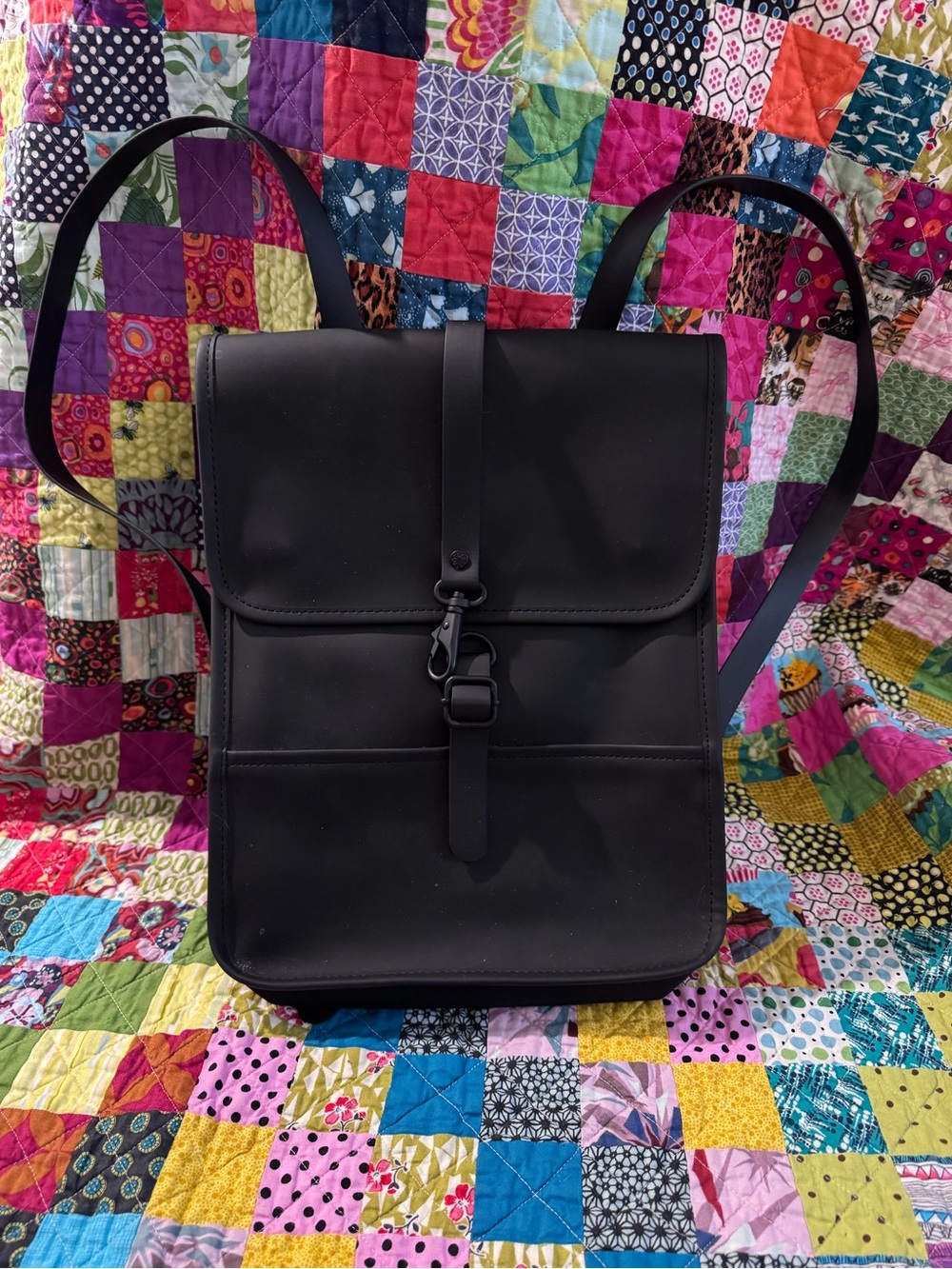Rains Black Minimalist Backpack with Front Buckle